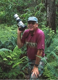 A partial list of publications that have featured his work include; Audubon Magazine, Smithsonian, Life, Natural History, Birders World, National Wildlife, Pacific Discovery, Defenders of Wildlife, Science, National Park, the National Geographic Canon Endangered Species Series, as well as numerous books, text books, and calendars. Bird photography has become a passion, almost an obsession for me. Every time I head out to photograph, different opportunities present themselves. Whether it’s different light, birds on feeding on different native flowers, or an unusual behavior…. every day is different. Each opportunity provides me with new and exciting images. I don’t know about you, but I still get excited when I down load my files at the end of the day and see the images on my lap top screen after a long day of shooting. Many of Hawaii’s birds are on the brink of extinction. I’d hate to think that I’m only recording images of these magnificent creatures for posterity. I’d rather believe that through my photography, I am providing an emotional link between humanity and the birds. If I do what I love… my passion…I feel that I’m doing my best to ensure that Hawaii’s people, and visitors from around the world, will continue to have opportunities to enjoy these colorful forest treasures for many generations to come. My photography is for the birds! ​